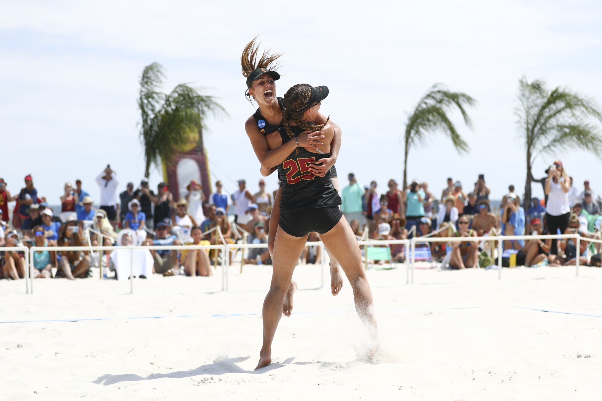 USC's Sammy Slater and Julia Scoles celebrate after defeating UCLA.