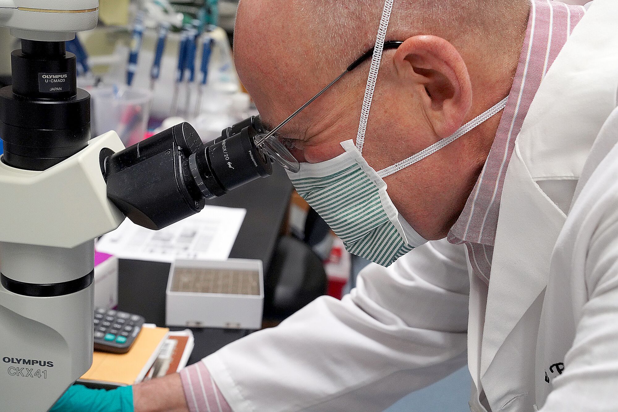  Scientist Chris Parks looks into a lab instrument.