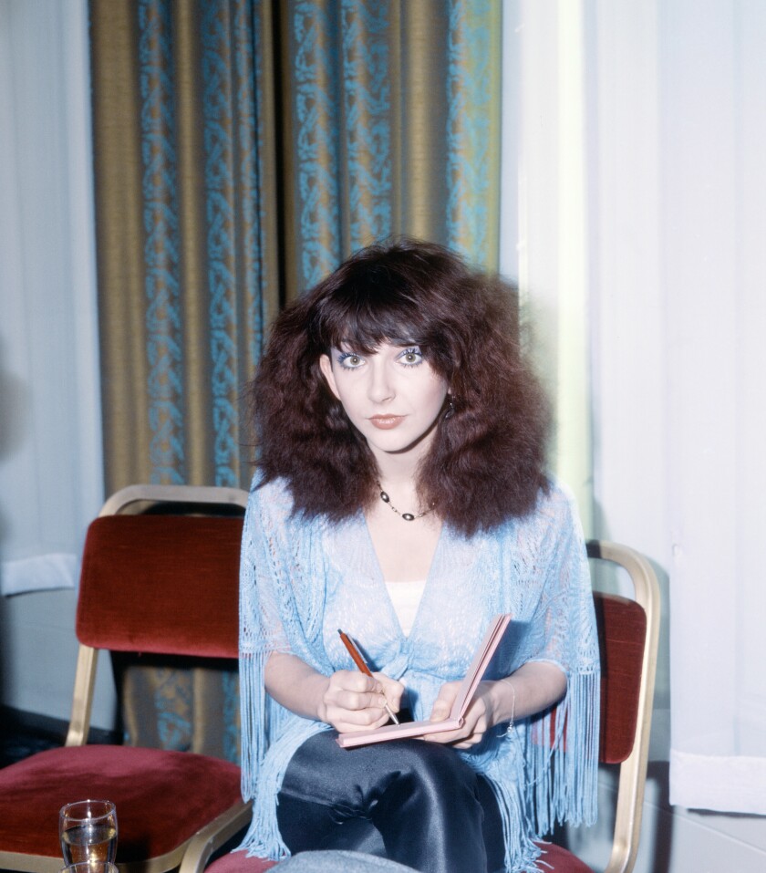 Kate Bush signs an autograph.