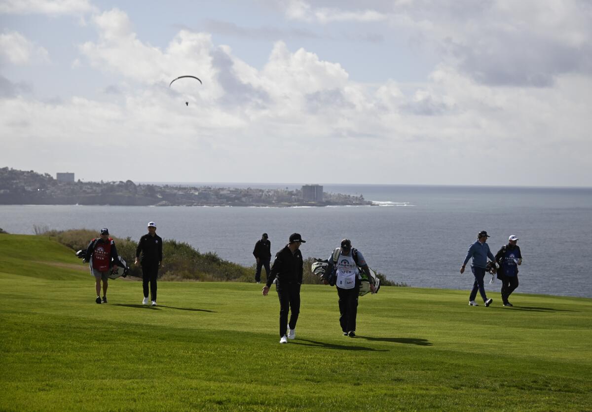 Golfers walk along the fourth hole of the South Course during the Farmers Insurance Open at Torrey Pines in January.