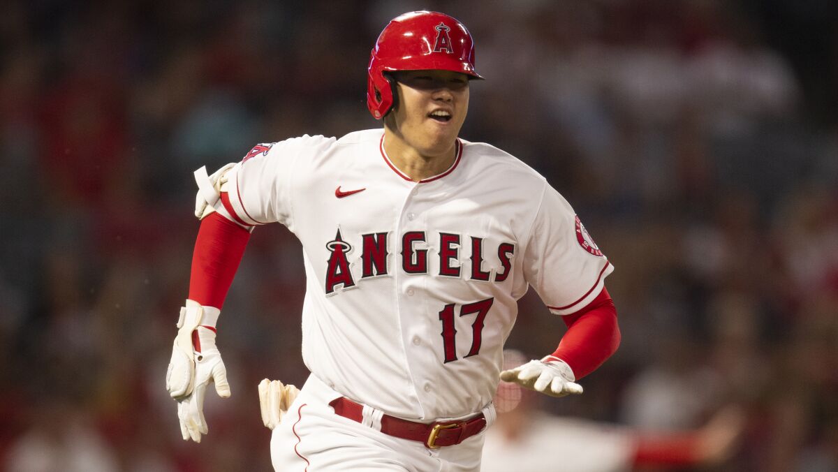 Shohei Ohtani sprints to first during an Angels game against the Detroit Tigers. (AP Photo/Kyusung Gong)