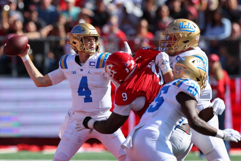 PISCATAWAY, NEW JERSEY - OCTOBER 19: Ethan Garbers #4 of the UCLA Bruins throws a pass during the first half of their game against the Rutgers Scarlet Knights at SHI Stadium on October 19, 2024 in Piscataway, New Jersey. (Photo by Ed Mulholland/Getty Images)