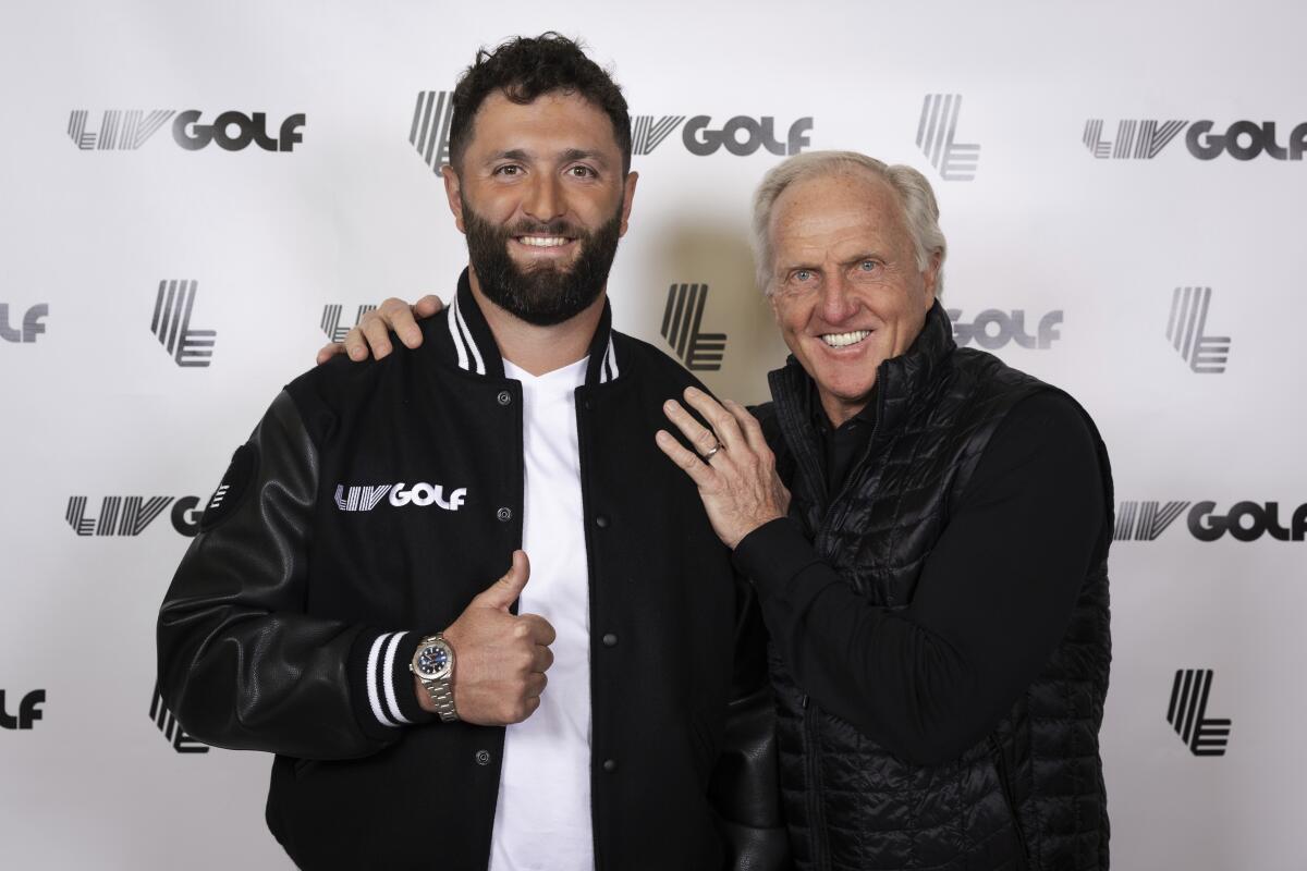 In a photo provided by LIV Golf, Jon Rahm, left, and LIV Golf Commissioner and CEO Greg Norman.