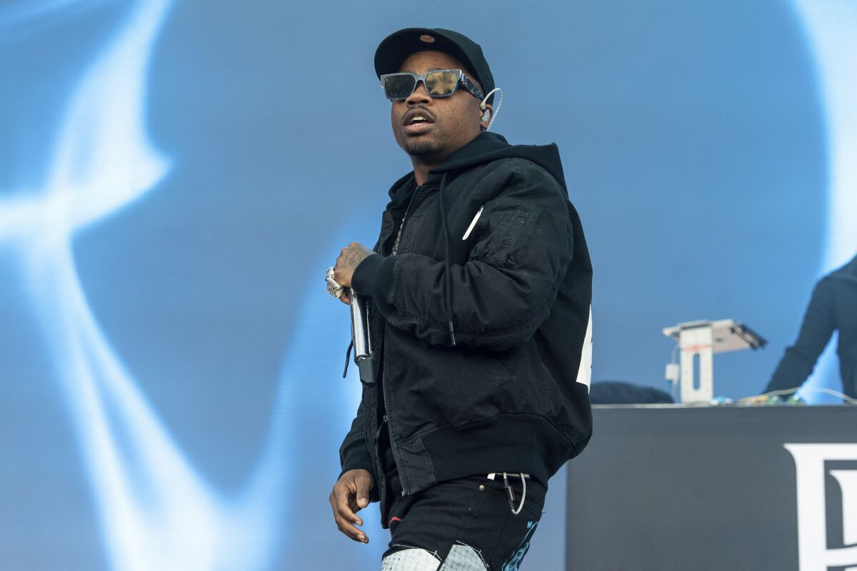 FILE - Roddy Ricch performs at day one of the Astroworld Music Festival at NRG Park on Nov. 5, 2021, in Houston. Authorities have dropped criminal charges against Ricch following a gun arrest Saturday, June 11, 2022, in New York City that forced him to miss a scheduled concert performance. (Photo by Amy Harris/Invision/AP, File)