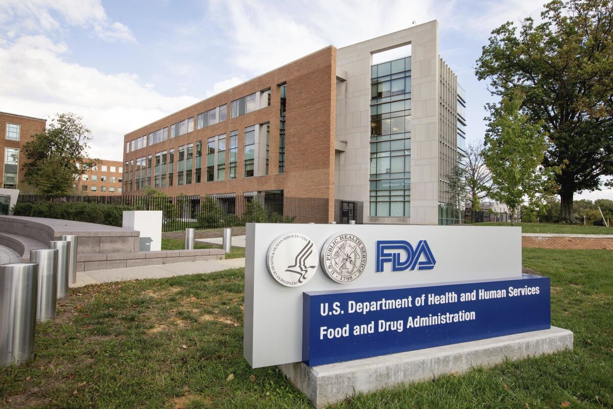 The Food and Drug Administration sign in front of several buildings.