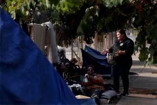 LOS ANGELES, CA - OCTOBER 10, 2024 - - Los Angeles City Council Member Eunisses Hernandez speaks with some of the homeless who live on Beacon Street as members of USC Street Medicine visit and treat them for health issues on Beacon Street in the Westlake District of Los Angeles on October 10, 2024. (Photograph by Genaro Molina)