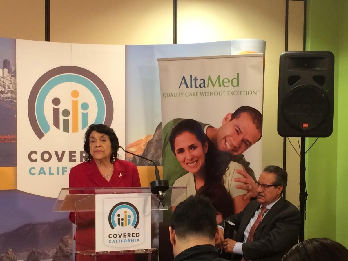 At an AltaMed clinic in Los Angeles, labor activist Dolores Huerta encourages people to sign up for insurance through Covered California.