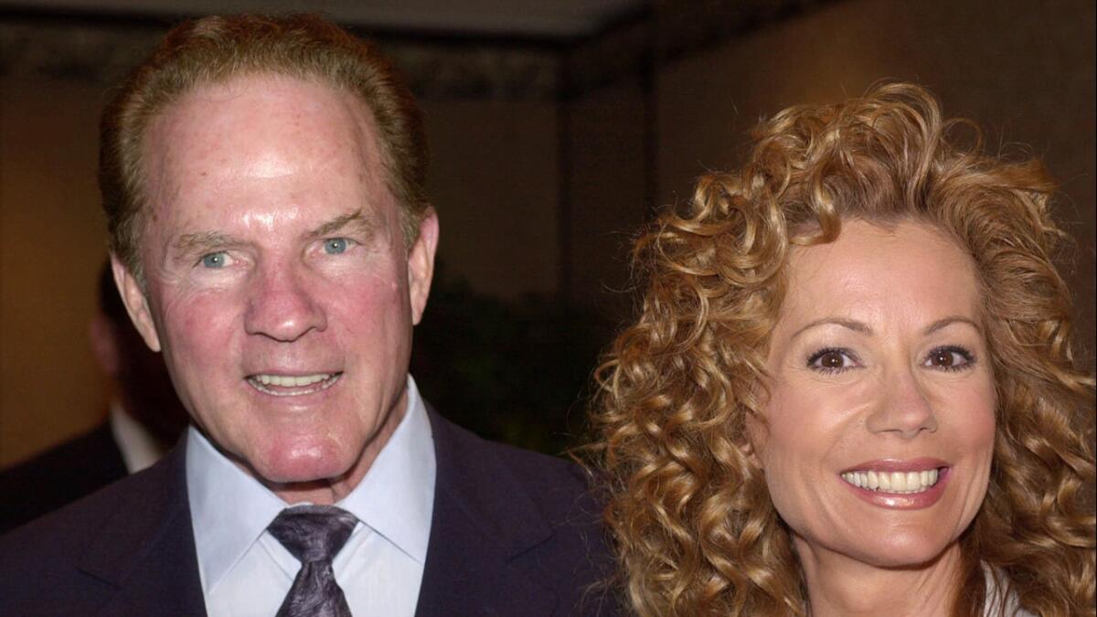 Sports announcer Frank Gifford and his wife, entertainer Kathie Lee Gifford, arrive at the New Dramatists Awards Luncheon in May 2000.