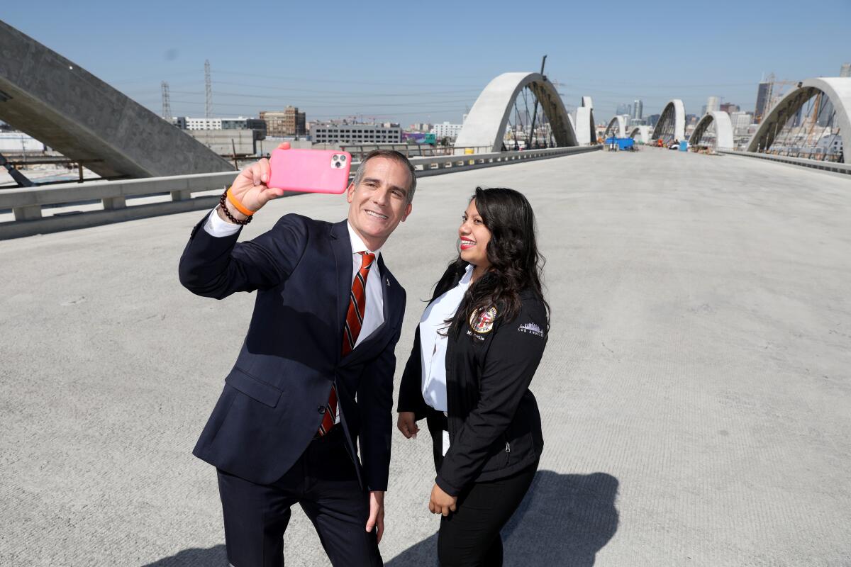Los Angeles Mayor Eric Garcetti, left, takes a selfie with Michelle Vergara, a City of Los Angeles employee