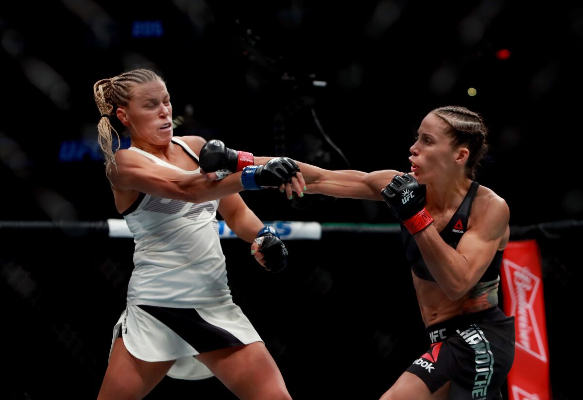 Liz Carmouche lands a punch against Katlyn Chookagian during their bantamweight bout at UFC 205.