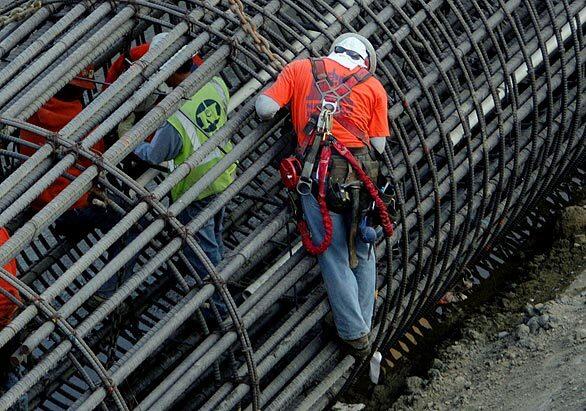 Construction crews prepare a huge rebar column as they work on the Gold Line extension over the 1st Street Bridge. Los Angeles city crews are in the process of widening the historic bridge to allow two lanes of traffic on both side sof the tracks.