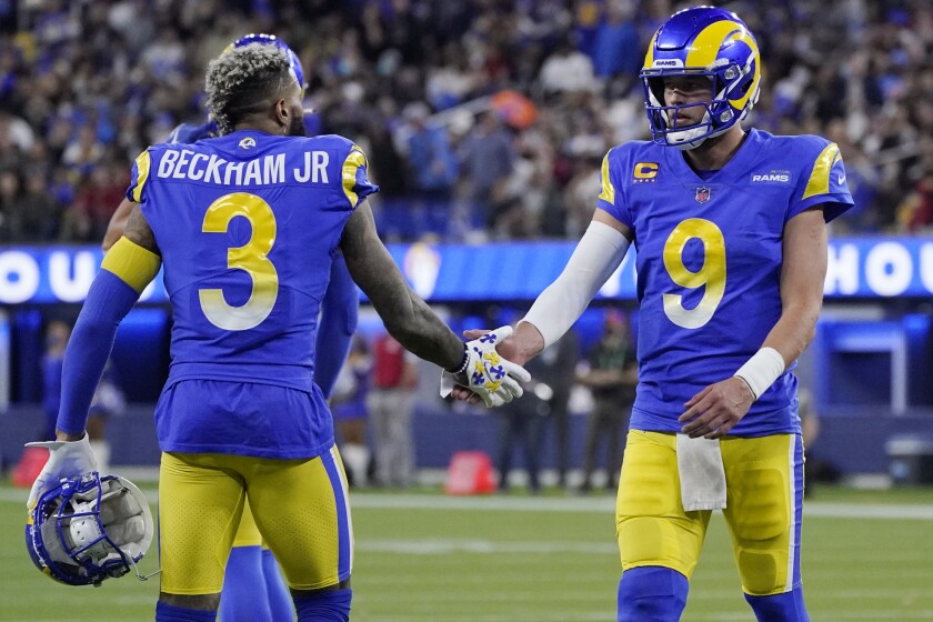 Los Angeles Rams wide receiver Odell Beckham Jr. (3) celebrates with quarterback Matthew Stafford (9) during the first half of an NFL wild-card playoff football game against the Arizona Cardinals in Inglewood, Calif., Monday, Jan. 17, 2022. (AP Photo/Mark J. Terrill)