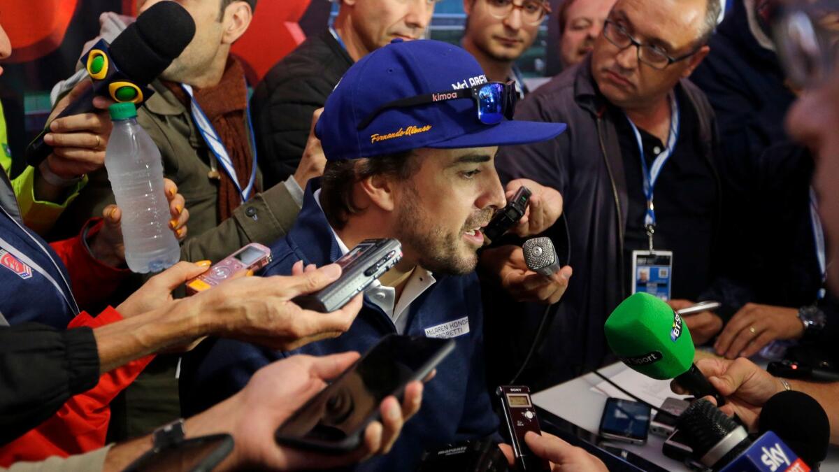 Fernando Alonso speaks to reporters at Indianapolis Motor Speedway on May 25.