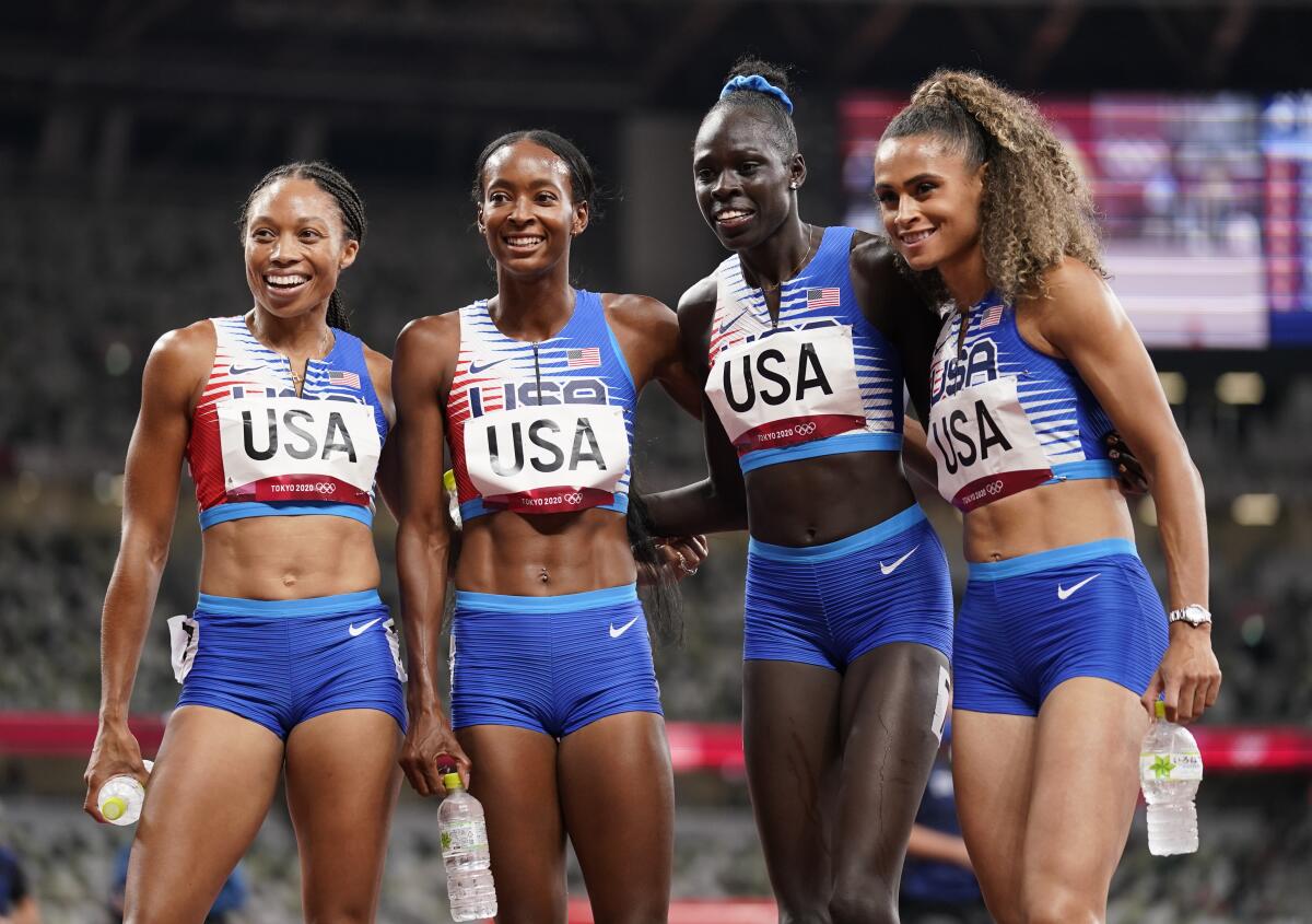 The U.S.1,600-meter relay team of (from left) Allyson Felix, Dalilah Muhammad, Athing Mu, and Sydney McLaughlin