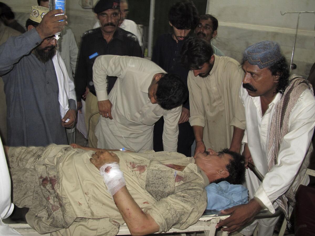 A Pakistani man who was injured in a suicide bombing at the home of a provincial government minister receives treatment at a hospital in Dera Ismail Khan.