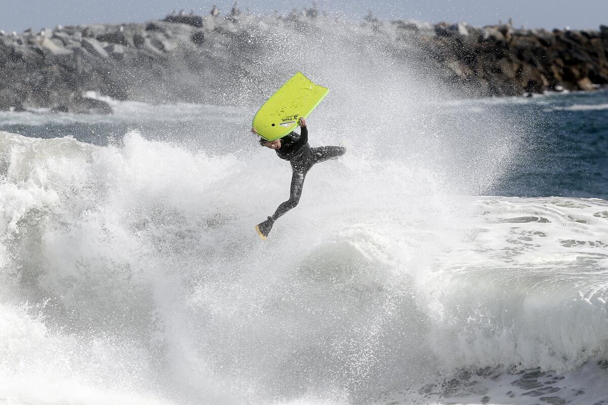 A bodyboarder loses control coming off a wave at The Wedge in Newport Beach.