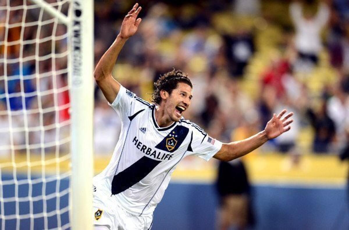 Galaxy defender Omar Gonzalez celebrates after scoring against Juventus during a game at Dodger Stadium.