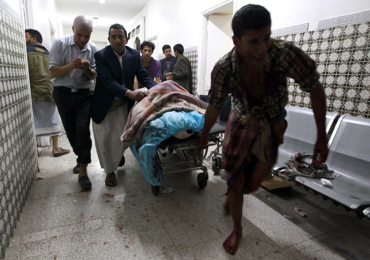 A severely injured man arrives at a hospital in Sana, Yemen, after bombings at a mosque.