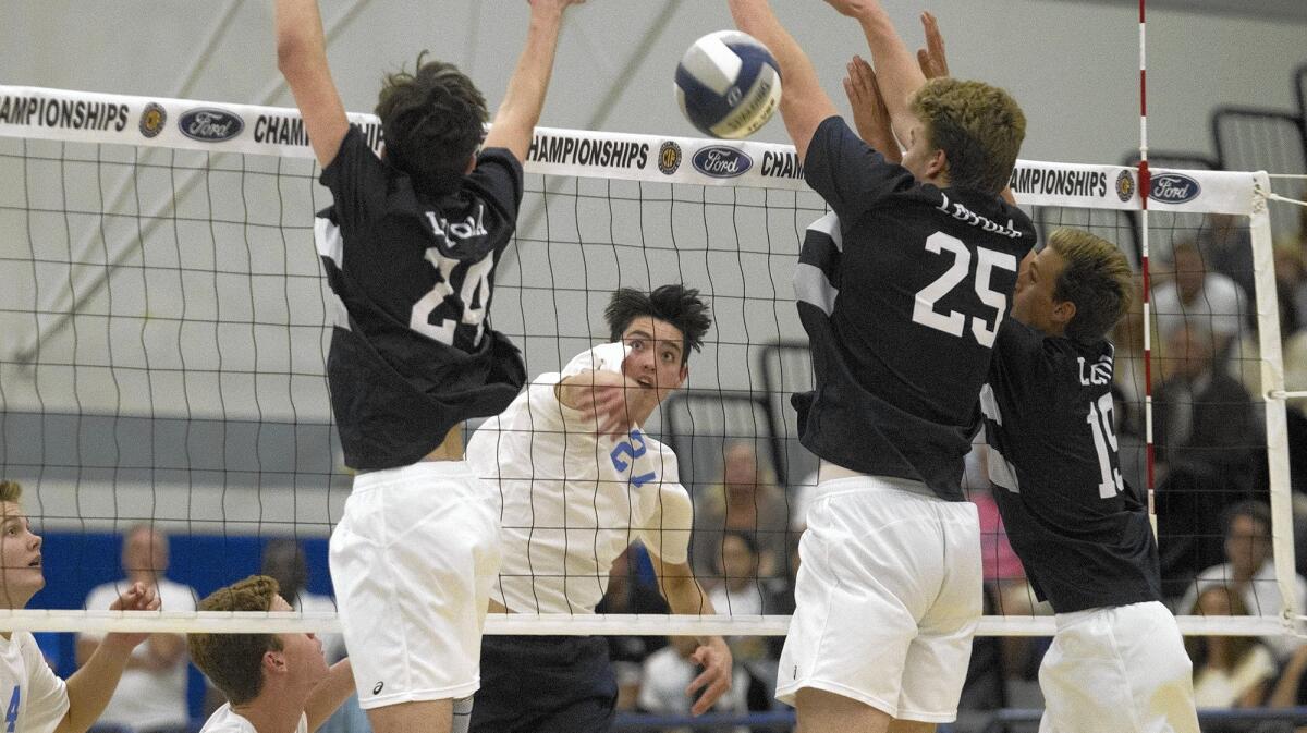 NORWALK, CA, May 21, 2016 -- Corona del Mar High's Brandon Browning, center, scores during the second set against Loyola in the CIF Southern Section Division 1 championship match at Cerritos College in Norwalk on Saturday. (Kevin Chang/ Daily Pilot)