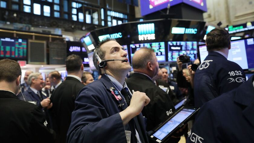 Traders work on the floor of the New York Stock Exchange on Feb. 9.