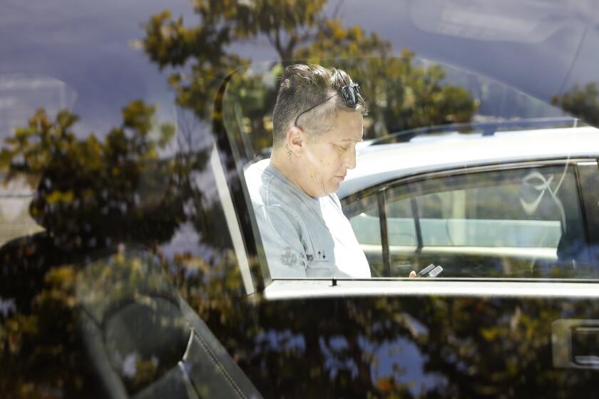 PASADENA-CA-JULY 21, 2023: Crisis interventionist Vicki Lucas, steps out of her car during a search for Sherry Hill's daughter living on the streets of Pasadena on July 21, 2023. (Christina House / Los Angeles Times)