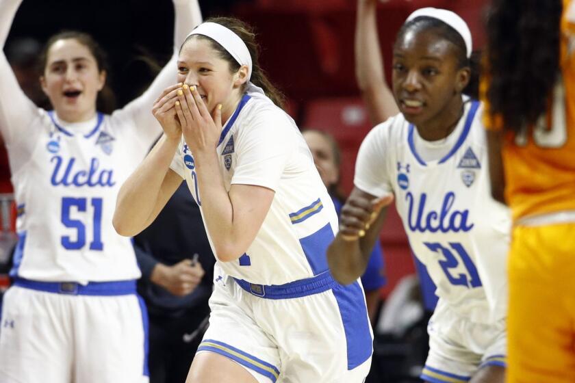 UCLA guard Lindsey Corsaro, second from left, reacts after making a 3-pointer in the second half of a first-round game against Tennessee in the NCAA women's college basketball tournament, Saturday, March 23, 2019, in College Park, Md. UCLA won 89-77. (AP Photo/Patrick Semansky)