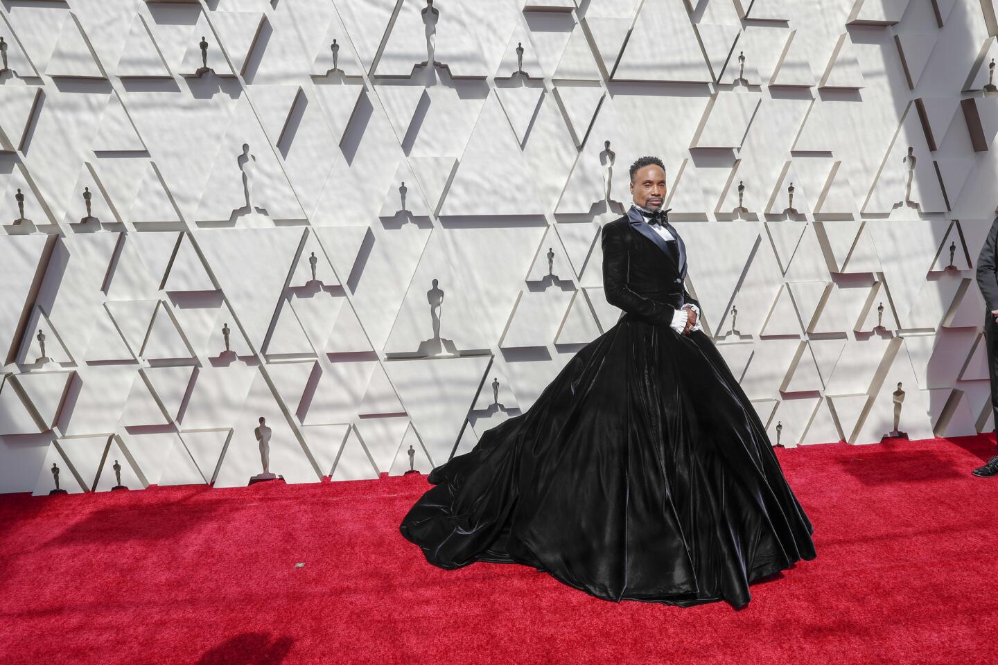 HIT: Billy Porter owned the Oscars red carpet in a custom velvet and satin tuxedo jacket by Christian Siriano over a strapless ball gown. As a result, he became a trending topic on social media during pre-Oscars coverage.