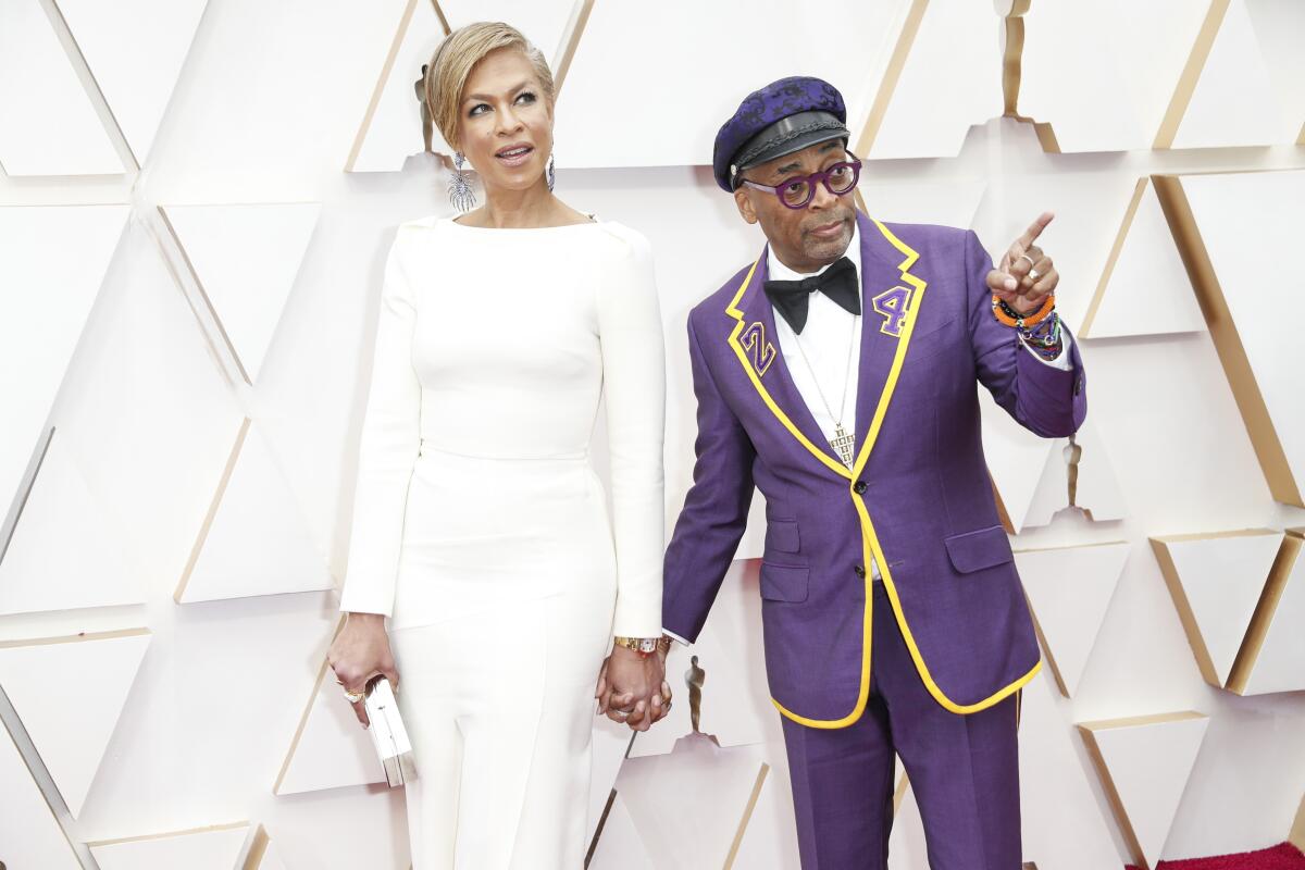 Tonya Lewis Lee, left, and husband Spike Lee.