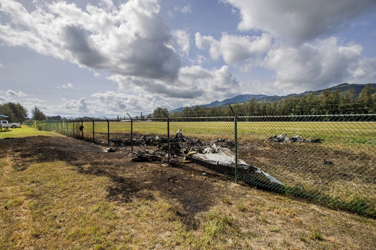 The charred remains of a skydiving plane that crash on Oahu's North Shore are shown near Waialua, Hawaii. 