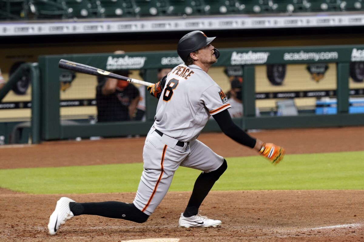 San Francisco Giants' Hunter Pence hits a three-run home run against the Houston Astros during the seventh inning of a baseball game Tuesday, Aug. 11, 2020, in Houston. (AP Photo/David J. Phillip)