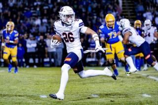 Ryan Abughazaleh of Chaminade heads to end zone on his way to 30-yard interception return for touchdown against Bishop Amat.