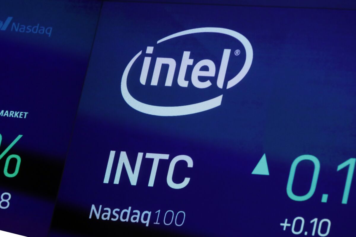 FILE - In this Oct. 1, 2019, file photo the symbol for Intel appears on a screen at the Nasdaq MarketSite, in New York. Intel is replacing its CEO after two years. The computer company said Wednesday, Jan. 13, 2021, that Pat Gelsinger will become its new CEO, effective Feb. 15. He takes over for Bob Swan, who became CEO in January 2019. (AP Photo/Richard Drew, File)