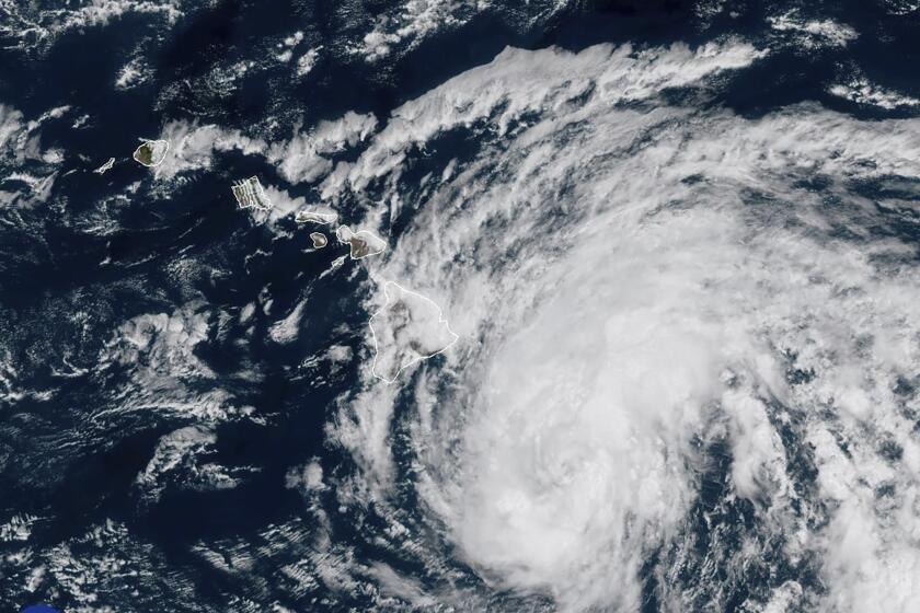 This image provided by the National Oceanic and Atmospheric Administration shows Tropical Storm Hone as it continues to track to the west toward the Hawaiian Islands, Saturday, Aug. 24, 2024. (National Oceanic and Atmospheric Administration via AP)