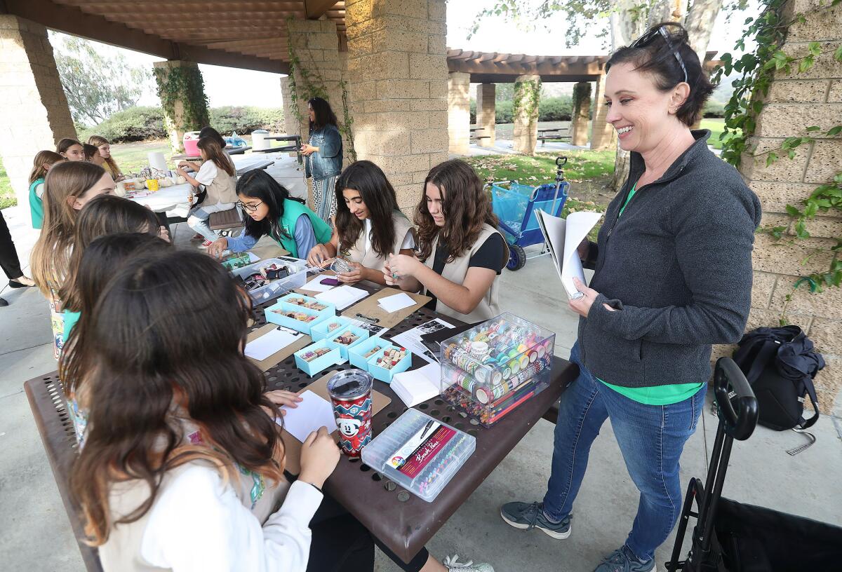 Troop leader Lisa Anhalt leads Scouts in an art project during an Oct. 28 meeting at Newport Ridge Community Park.