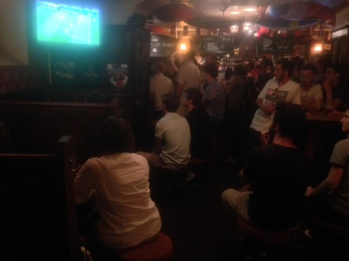 British nationals cheer on England's soccer team at the London Town Pub in Toulouse, France.