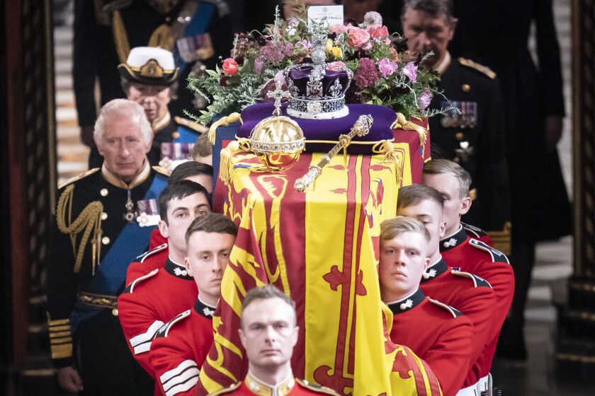 LONDON, ENGLAND - SEPTEMBER 19: King Charles III follows behind the coffin of Queen Elizabeth II, draped in the Royal Standard with the Imperial State Crown and the Sovereign's orb and sceptre, as it is carried out of Westminster Abbey. after the State Funeral of Queen Elizabeth II on September 19, 2022 in London, England. Elizabeth Alexandra Mary Windsor was born in Bruton Street, Mayfair, London on 21 April 1926. She married Prince Philip in 1947 and ascended the throne of the United Kingdom and Commonwealth on 6 February 1952 after the death of her Father, King George VI. Queen Elizabeth II died at Balmoral Castle in Scotland on September 8, 2022, and is succeeded by her eldest son, King Charles III. (Photo by Danny Lawson - WPA Pool/Getty Images)