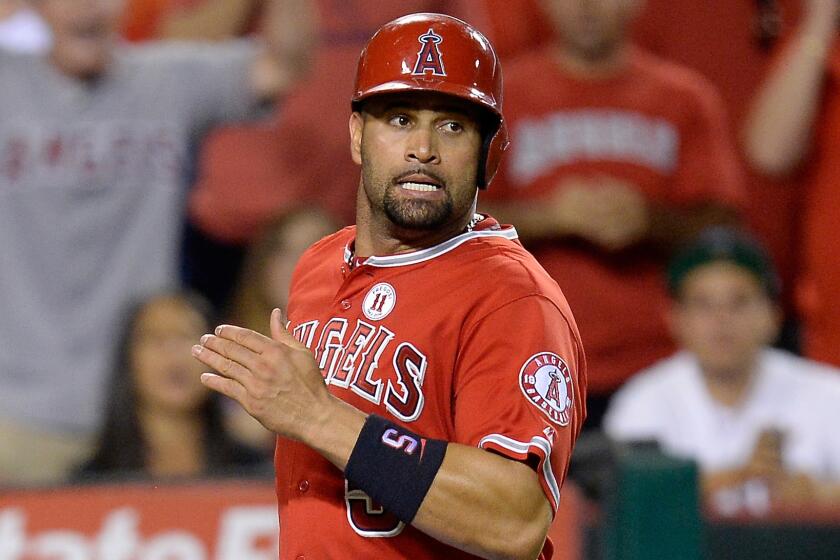 Angels first baseman Albert Pujols scores a run during the sixth inning of the team's 7-2 win over the Philadelphia Phillies on Tuesday.