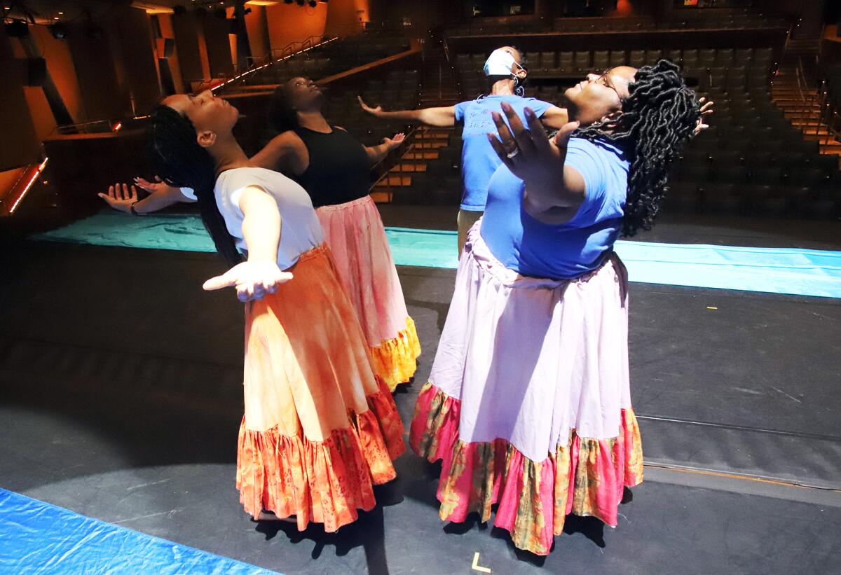 Dancers rehearse a scene that chronicles African American lives during a dress rehearsal of Gospel Voices of OC.