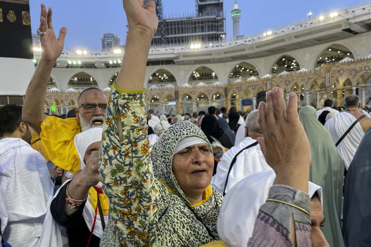 Iranian pilgrims circumambulate around the Kaaba.