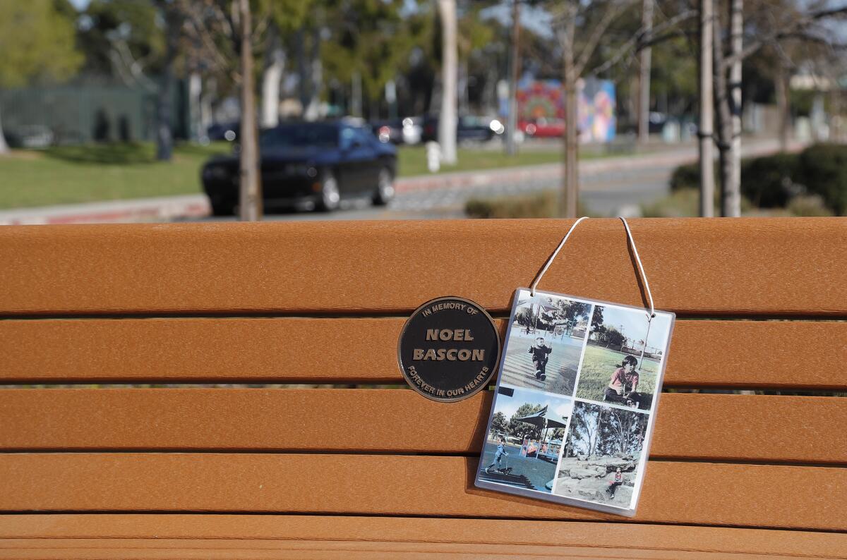 A memorial bench for 12-year-old Noel Bascon at the intersection of Arlington and Junipero drives in Costa Mesa. 