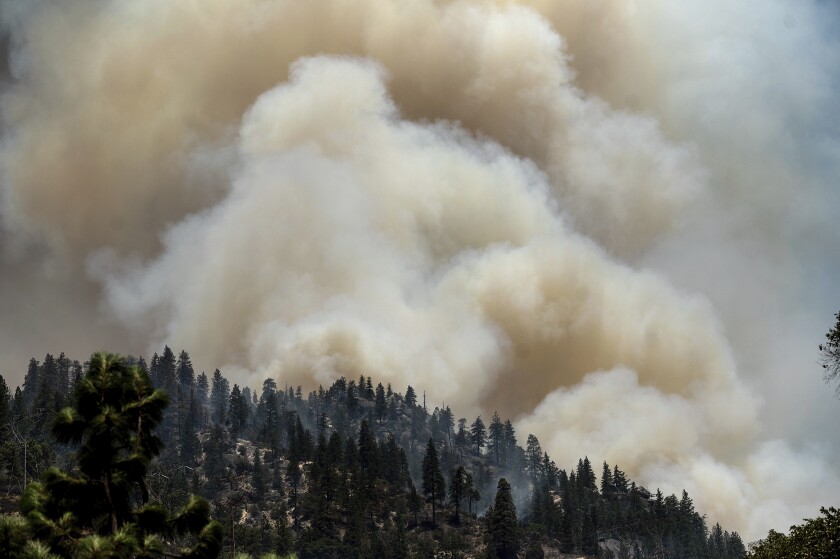 Smoke rises from the Dixie fire.
