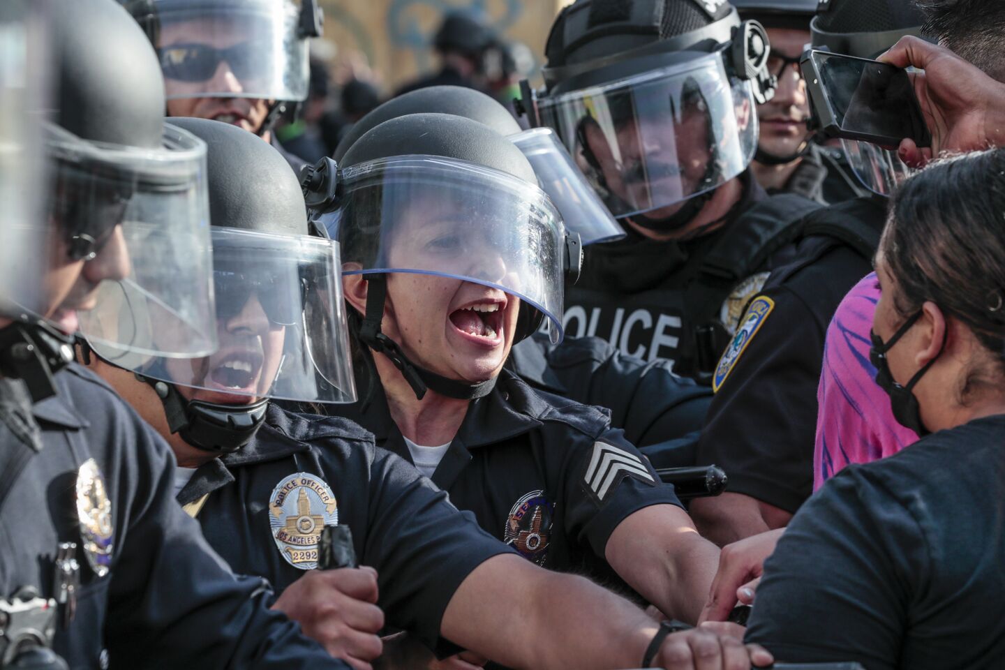 Police and protesters face off in Santa Monica on Sunday.