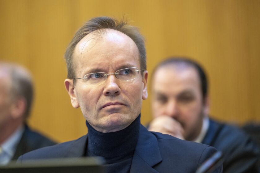 Former Wirecard CEO Markus Braun sits in the dock in the courtroom at the start of the trial against the former CEO and two co-defendants at Munich Regional Court 1 Munich, Germany, Thursday, Dec. 8, 2022. The trial is being held in an underground courtroom next to the Munich-Stadelheim correctional facility. Almost two and a half years after the collapse of the Wirecard Group, the criminal trial in what is believed to be the biggest fraud case in German post-war history began on Thursday. (Peter Kneffel/dpa via AP)