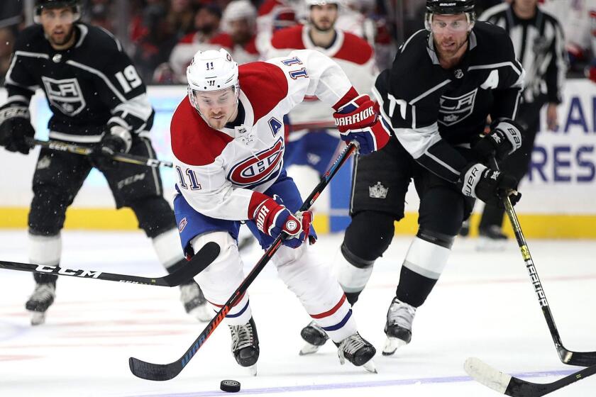 LOS ANGELES, CALIFORNIA - MARCH 05: Brendan Gallagher #11 of the Montreal Canadiens skates past Jeff Carter #77 of the Los Angeles Kings during the third period of a game at Staples Center on March 05, 2019 in Los Angeles, California. (Photo by Sean M. Haffey/Getty Images) ** OUTS - ELSENT, FPG, CM - OUTS * NM, PH, VA if sourced by CT, LA or MoD **