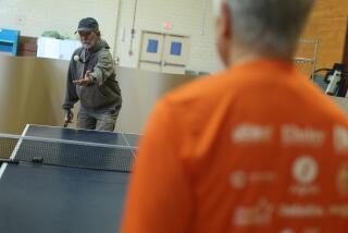 North Hills, CA - March 14: Ray Emmons , 76, left, plays ping pong on the other side of Conrad Amers, 71, right, during golden age games training at Sepulveda VA Medical Center on Thursday, March 14, 2024 in North Hills, CA. (Michael Blackshire / Los Angeles Times)