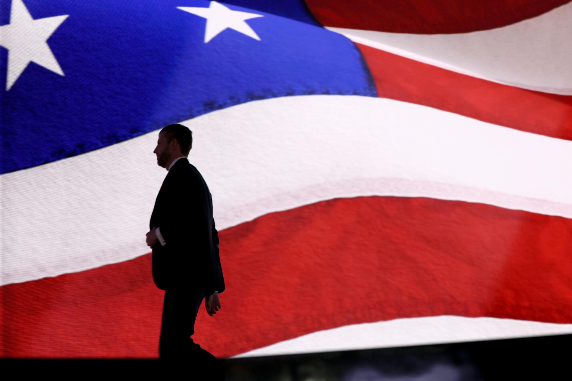 Eric Trump, Donald Trump's son, walks off the stage during the Republican National Convention.