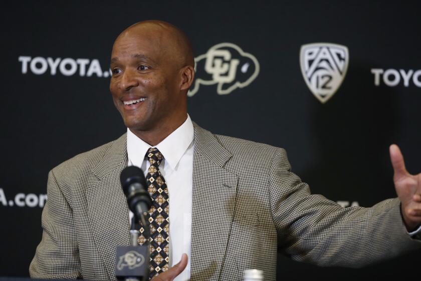 Karl Dorrell jokes with reporters during a news conference to announce that he is the new NCAA college head football coach at Colorado during a news conference Monday, Feb. 24, 2020, in Boulder, Colo. (AP Photo/David Zalubowski)