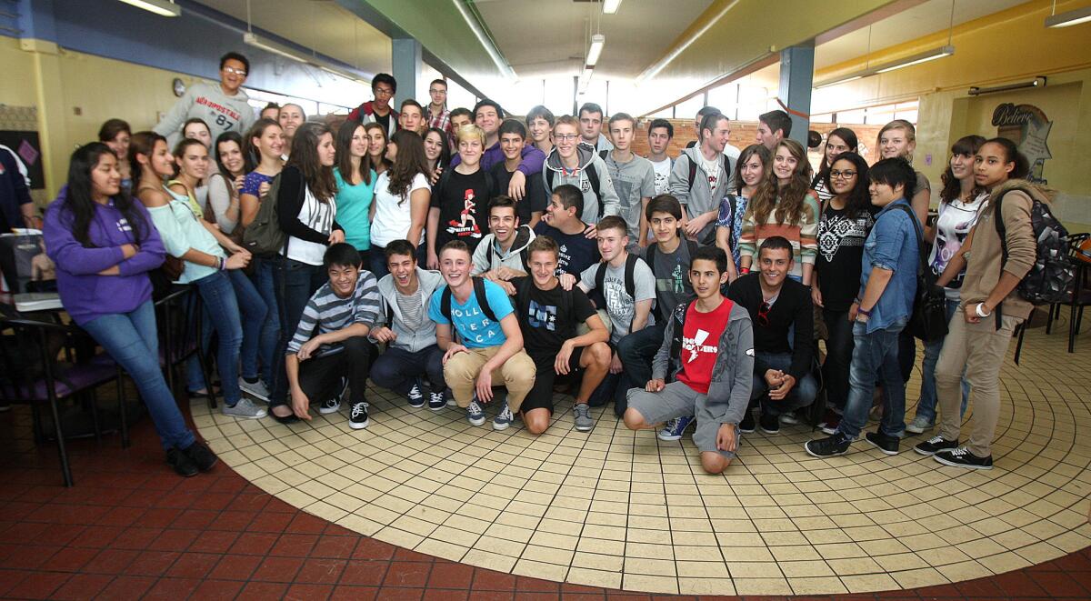 Hoover High School students and their 40 French pen pals gather for a big group photo in the cafeteria during a reception at Hoover High School in Glendale on Monday, Oct. 14, 2013. The French students will be attend Hoover for two weeks, just as Hoover students did last year in France.