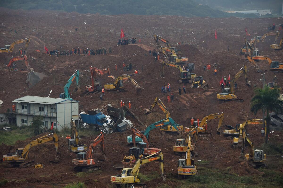 Rescue workers look for survivors after a landslide hit an industrial park in Shenzhen in south China's Guangdong province.