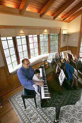 GRAND AIMS: Music executive Jay Landers gives daughter Sophia some early lessons in their Coldwater Canyon home.